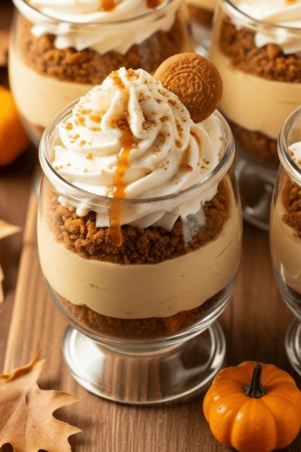 no-bake pumpkin cheesecake trifle cups with gingersnap crumbs and caramel drizzle