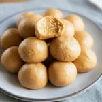 3-Ingredient Peanut Butter Balls (No Bake) 10-Minute, Freezer-Friendly Snack 2 Overhead tray of 3-ingredient peanut butter balls (no bake) on parchment