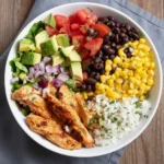 Recipe card for High-Protein Chicken Burrito Bowls with macros and meal prep notes