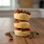 Chocolate Pecan Tartlets 2 ocolate pecan tartlets on serving plate