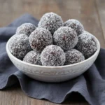 Coconut chocolate protein bites broken open