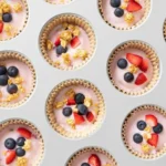 No Bake Frozen Yogurt Sandwich Bites (3 Ingredients!) 2 Hand holding a frozen yogurt sandwich bite