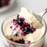 Spoonful of berry cream dessert