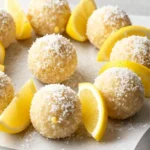 Lemon Coconut Bliss Balls 2 Lemon coconut bliss balls with fresh lemon slices