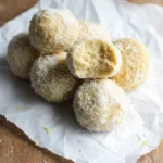 bite taken from lemon coconut bliss ball