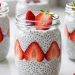 Healthy strawberry chia pudding in mason jars