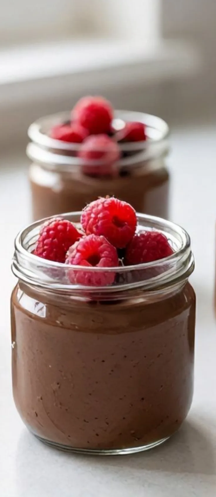 Serving Chocolate Tofu Dessert Spoon scooping chocolate tofu dessert from cup