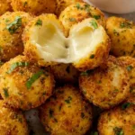 Crispy Cheesy Mozzarella Bites 2 crispy mozzarella bites with cheese pull